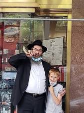 Rabbi Yisroel Stone and his son Menachem. Photo courtesy of Rabbi Yisroel Stone