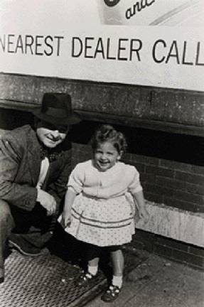 A two-year-old Eleanor Reissa with her father, Chaskel Schlusselberg, an Auschwitz survivor, in the East New York section of Brooklyn.