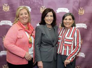 Assembly woman Rebecca Seawright (left) joined Governor Kathy Hochul in a ceremony in Albnay honoring Upper East Side community activist Amy Scwartz (right).