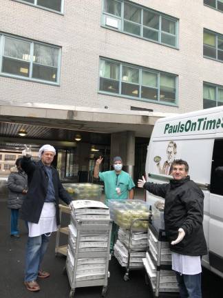 Niki Krkuti, Dino Redzic and Leo Krkuti of Uncle Paul's Pizza delivering pizzas to Metropolitan Hospital on March 28, 2020.