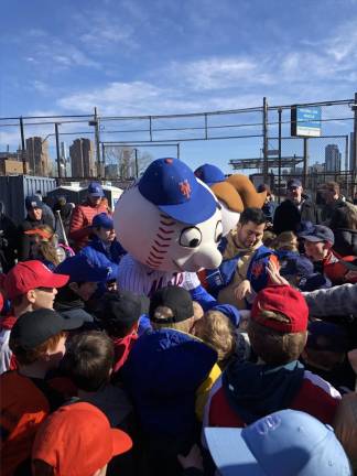 <b>Mr. Met and Mrs. Mets, mascots of the NY Mets MLB team, get mobbed by youngsters at a surprise appearance April 2nd at the opening day parade and ceremony of the Peter Stuyvesant Little League at historic Con Ed field.</b> Photo: Keith J. Kelly