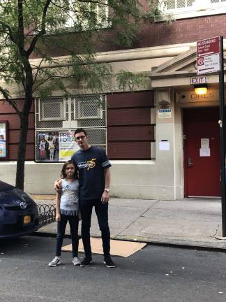 PTA activist Tom Wrocklage and his fourth-grade daughter, Georgia, outside P.S. 290 on East 82nd Street this weekend. The 9-year-old girl and her classmates have to nowhere to play but the street. Photo courtesy of Tom Wrocklage