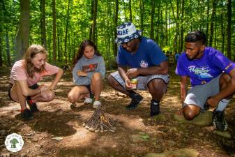 There is a fine art to building a campfire as campers at the Nature Place Camp in Chestnut Ridge in Rockland County discover. Photo: The Nature Place