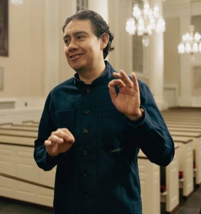 Alejandro Hernandez-Valdez hails from Mexico and joined his first church choir when he was eight. But he always wanted to be a conductor and he said he would buy sheet music simply to practice his conducting. Photo: Alejandro Ibarra