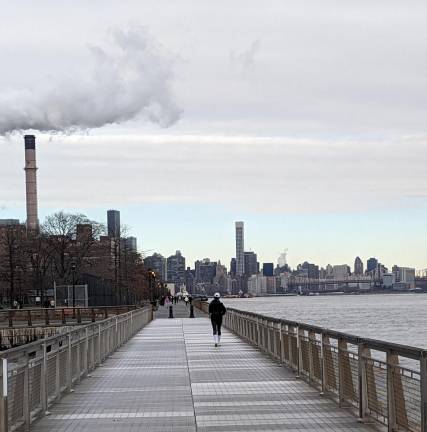 <b>The loneliness of the long distance runner may be less lonely now that East River Esplenade has finally re-opened a two mile stretch between E. 34th St. and the Williamsburg Bridge</b>. Photo: Brian Berger