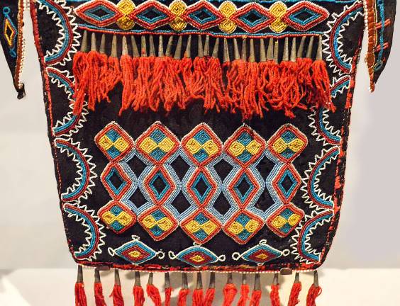 An artist from the Delaware people in Kansas, ca. 1840, created this vibrantly designed beaded bag used in formal men&#x2019;s attire. Photo: Adel Gorgy.