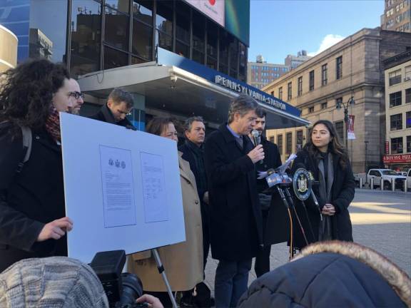 NYS Senator Brad Hoylman-Sigal (at mic) and Assemblyman Tony Simone (back row, left of Hoylman) have introduced legislation that would block MSG Entertainment boss James Dolan from banning attorneys and other opponents with legitimate tickets from entering sporting events. MSG argues that the extension will only help ticket scalpers. Photo: Keith J. Kelly