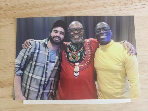 Brown (center) with Wes Enos (left) and John Young (right) during Brown’s housewarming celebration sponsored by The Generations Project, included in the Stonewall 50 time capsule. Photo courtesy of Reginald Brown