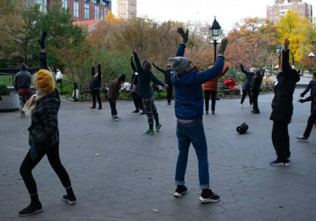 Older dancers reach for the sky during one of Naomi Goldberg-Haas’s classes in Nov. 2023 in Washington Square Park Photo: Mimi Lamarre