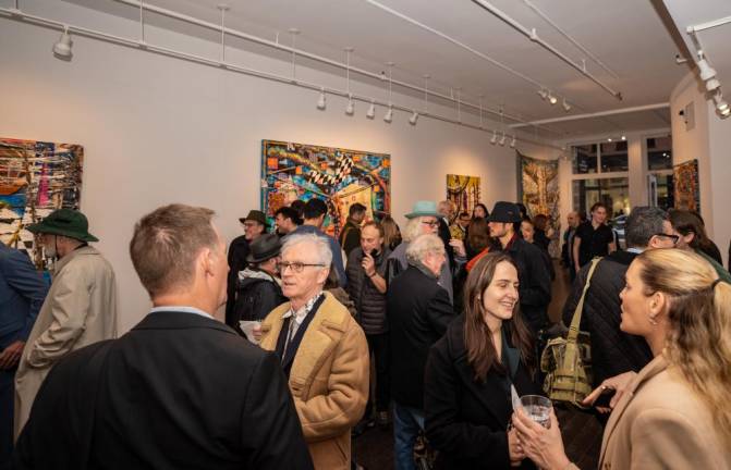 <b>Reid Stowe attracts a big crowd to opening night of his Oceanic Feelings exhibit March 23. His first solo show at Chase Contemporary in SOHO runs until April 16.</b> Photo: Chase Contemporary
