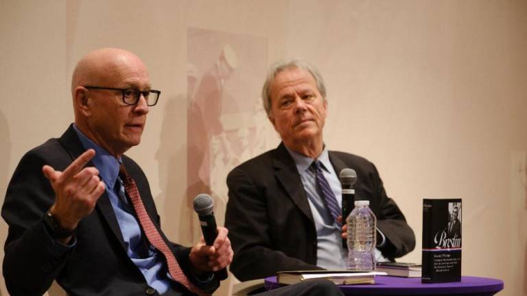 <i>NY Times</i> columnist Dan Barry (left) discusses the anthology <i>“Breslin: Essential Writing,”</i> which he compiled during a recent lecture with veteran city reporter Michael Daly at Hunter College. Photo: Matt Capowski