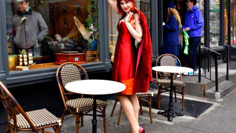 <i><b>Manhattan model Karen Rempel paints the town red at Travelers Poets &amp; Friends, a heartful Italian café market, bistro, and bakery, centered between the Pamina gelato shop and the elevated New Italian restaurant, Alaluna.</b></i>
