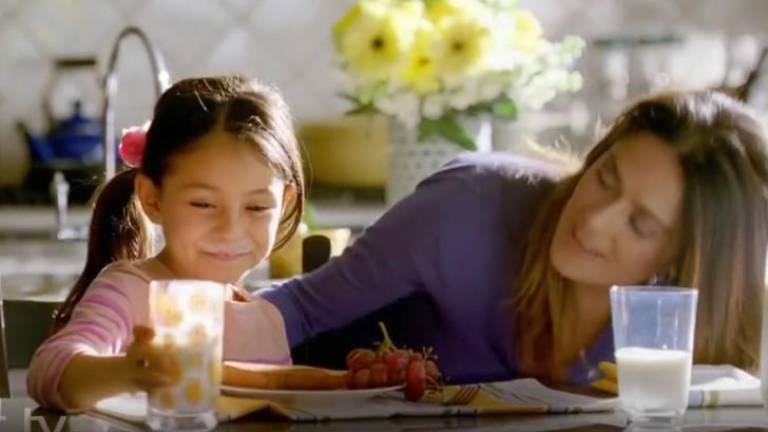 Selma Hayek was in a 2012 celebrity milk ad, pouring a glass of milk for her daughter. A glass of milk contains the relaxing amino acid tryptophan. Photo: Milk Processing Education Program