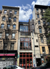 Though owner Eric Anderson has listed the property at 56 E. 1st St. for sale for nearly $10 million, the graffiti-tagged and concrete-stained panels may suggest why the property has lingered on Zillow for nearly seven years.