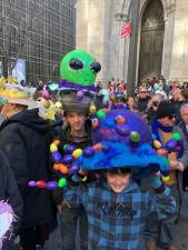 Eleven year old Sebastian Tobin (right) appears a lot more enthusiastic about the headwear designed by their mom than his 17 year old brother Ozzie outside St. Patrick’s Cathedral at the Easter Parade. <b>Photo: Keith J, Kelly</b>