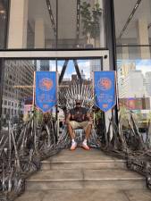 Karl-Anthony Towns, part of the NBA Championship-winning Knicks team, sat atop the Iron Throne prior the premiere House of the Dragon season 3 June 21.