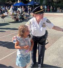 Deputy Inspector Noreen E. Lazarus, the commanding officer of the 19th Pct., was drafted into community relations duties when she helped a distraught youngster find her caregiver during a National Night Out Against Crime inside St. Catherine’s Park on Aug. 4.