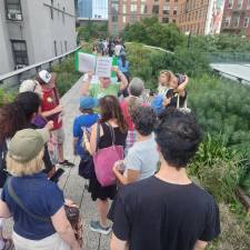 A docent leads a group of visitors on a tour of the High Line earlier this summer.