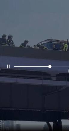 First responders on the FDR Drive on July 11 after a lunatic went on attempted car jacking rampage, before jumping over the side of the highway and breaking both his legs. Photo: Citizen app.