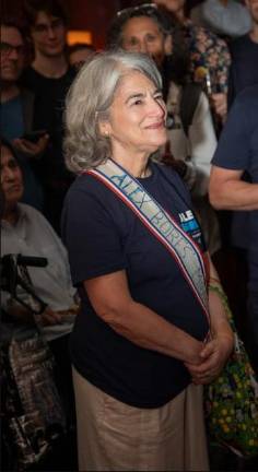 Lori Bores was frequently on the campaign trail with a sash identifying her as “Alex Bores’ Mom.”