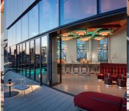 The Panorama Room atop the Graduate Hotel on Roosevelt Island is a great place to watch the sun go down with 360 degree views of Manhattan and Queens. Photo: Graudate Roosevelt Hotel