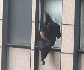 A suicidal man who was wanted by the FBI broke the window of his high rise apartment on West 56th after the FBI radie it and was dangling from the 31st floor before being rescued by an elite NYPD ESU team. Photo: Twitter@ImMeme)