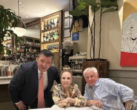 Mirso Lekic (left), who already owns the Tudor City Steakhouse, recently opened Benny John’s, a new hot spot on E. 48th St. where he greets current Post gossip columnist Cindy Adams and Our Town’s Editor in Chief Keith J. Kelly, who worked with Cindy for over 20 years while writing the Post’s Media Ink column. Photo: Courtesy Mirso Lekic