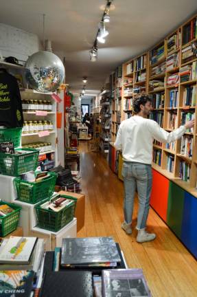 One of Altshuler’s employees organizes the shelves. Photo: Abigail Gruskin