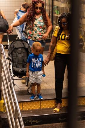 Just more than half of neighborhoods citywide don't have American Disabilities Act-accessible subway stations, which can be a burden to those with strollers or large packages, like these people, pictured at the 42nd Street/Bryant Park station. Photo: Jeremy Weine