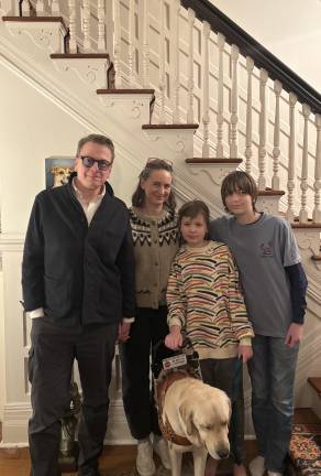 Naomi Wood with her parents, 14-year-old brother, and, of course, the family’s newest member, her service dog Elroy, at their home in Scarsdale, N.Y.