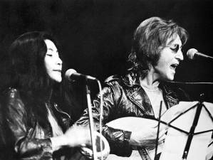 John Lennon and Yoko Ono, seen here performing at the Sinclair Freedom Rally in December 1971, had just released the “Double Fantasy” album in 1980 shortly before Lennon was murdered outside the Dakota apartment building where they lived. Photo: University of Michigan/Wikimedia Commons