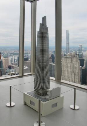 On the north side of the Summit, a model of One Vanderbilt is on display; the building is actually four towers, stacked one atop the other, both twisted and offset. Given its 1400 foot top, it is almost impossible to take in the entire building from close in. Photo: Ralph Spielman