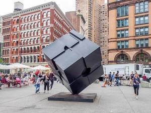 The Astor Place Cube (officially known as “Alamo”), pictured in its titular public square. It was originally completed by Tony Rosenthal in 1967. The Cube is currently being restored by the DOT and Versteeg Art Fabricators so that it can be “spun” in circles once again.