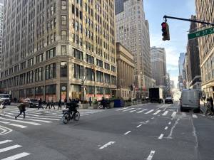 E-bikers such as the one above on Seventh Ave. last week, were routinely ignoring red lights even before Mayor Mamdani took away the criminal summons penalty for bike traffic infractions. The relaxed standards take hold on March 27.