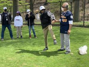 A vision impaired student learns how to throw a baseball. Photo: Kay Bontempo