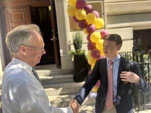 Loyola HS president Tony Oroszlany (left) greets junior Quinn Lowry on Sept. 4, the first day of the new school year of the Jesuit-affiliated high school.