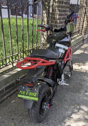No license, no license plate, no registration: a sparkling Fly E-Bike parked and ready for delivery. But is it really a “bicycle”?
