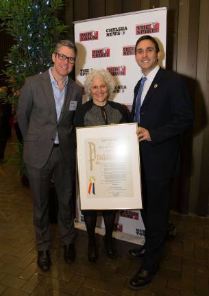 From left, Our Town Editor in Chief Kyle Pope, Straus News President Jeanne Straus, and Councilmember Ben Kallos, with a proclamation honoring the newspaper and the businesses being celebrated