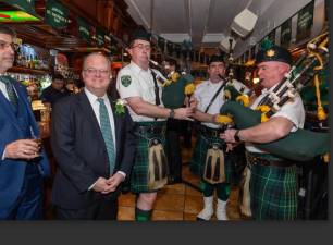 <b>Acting Supreme Court Justice Jim Clynes (front with neck tie) was feted as the Judicial Honoree by the Brehon Law Society at its recent St. Patrick’s Day dinner at Connolly’s Pub and Restaurant on E. 47th St.</b> Photo: David Finlay