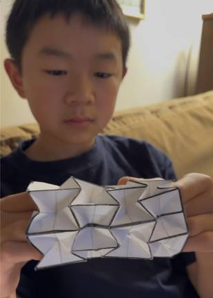 Miles Wu in his family’s Manhattan apartment, where he took over the living room to conduct all his tests and research.