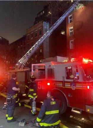 Firefighters from Ladder 5 on E. 14th St. stretched ladders to the roof of the five story building to do a floor-by-floor search to make sure everyone was safely evacuated. There were no civilian casualties but two firefighters were injured.