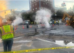 Steam was still billowing from mid-block on Aug. 3 after a water main break at the intersection of First Ave. and East 14th Street earlier that afternoon. Traffic would remain snarled for days as the intersection could remain closed.
