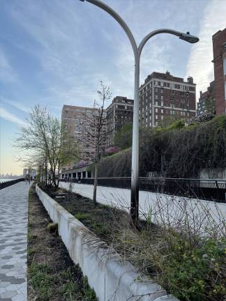 A fire tore through part of the East River Esplanade on April 12. The cause of the blaze is unclear. Advocates say that the installation of long-promised security cameras could have changed that.