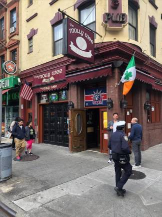 The Molly Wee, a pub which has stood on the corner of 30th and Eighth for over 40 years, and its next door neighbor, the Gardenia Deli, are among 20 plus establishments that might have to move unless Amtrak changes some of its plans. Photo: Keith J. Kelly