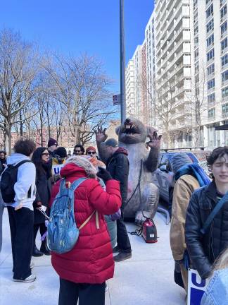 The striking faculty, who want better compensation and job security, have brought Scabby the Rat with them to the picket lines.