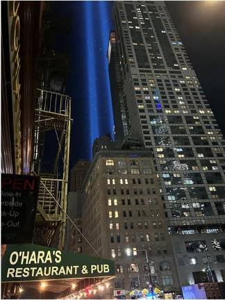The 9-11 tower of lights as viewed from the popular downtown pub O’Hara’s a short distance from Ground Zero.
