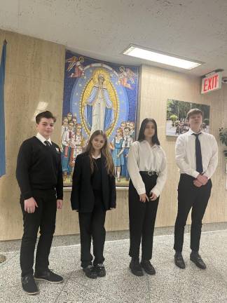 Left to right: Nazariy Kosar, Olha Stank, Nicole Kozmey, and Maksym Kosar. All four students came from Ukraine to St. George’s Academy. Photo: Kay Bontempo.