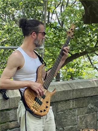Trevor Hochman jams in Riverside Park. Photo: Christopher Moore