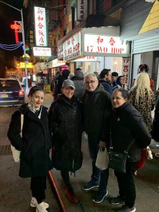 The author, second from left, with her sister and parents outside Wo Hop in Chinatown.