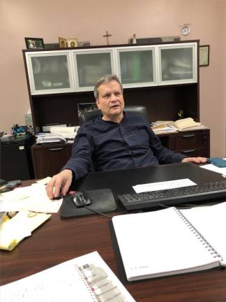 Principal Andrew Stasiw at St. George Academy says he tries to downplay the war but with over 60 students who arrived at the East Village high school since the Russian invasion a year ago, they inevitably find their own sources of news from their embattled homeland . Photo: Keith J. Kelly